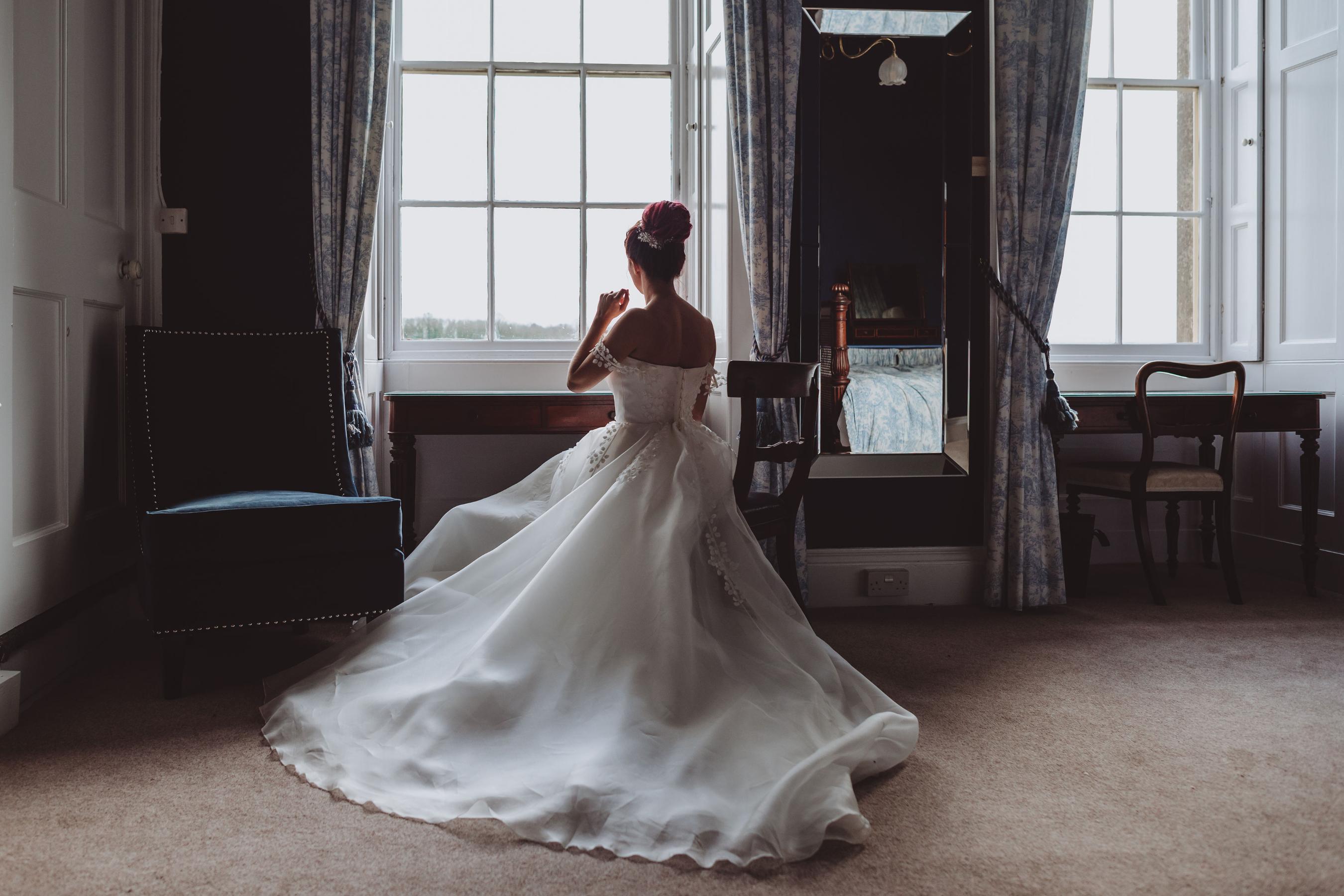 bride getting ready in the bridal suite at Prestwold Hall