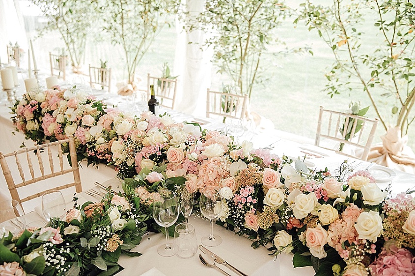 When you picture your wedding flowers, what do you see? A modest bouquet and some buttonholes? A handful of vases filled with pretty blooms? Or maybe your imagination runs wild and you dream of filling your wedding with as many blooms as possible?