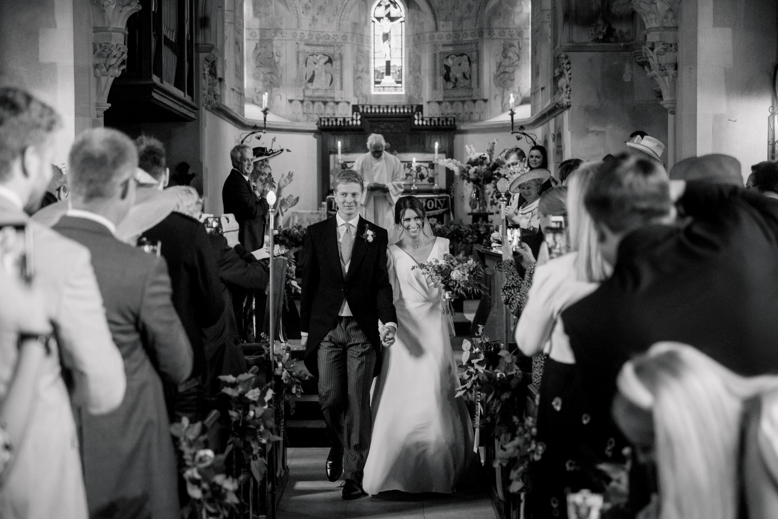 couple on their wedding day in an elegant church ceremony set up