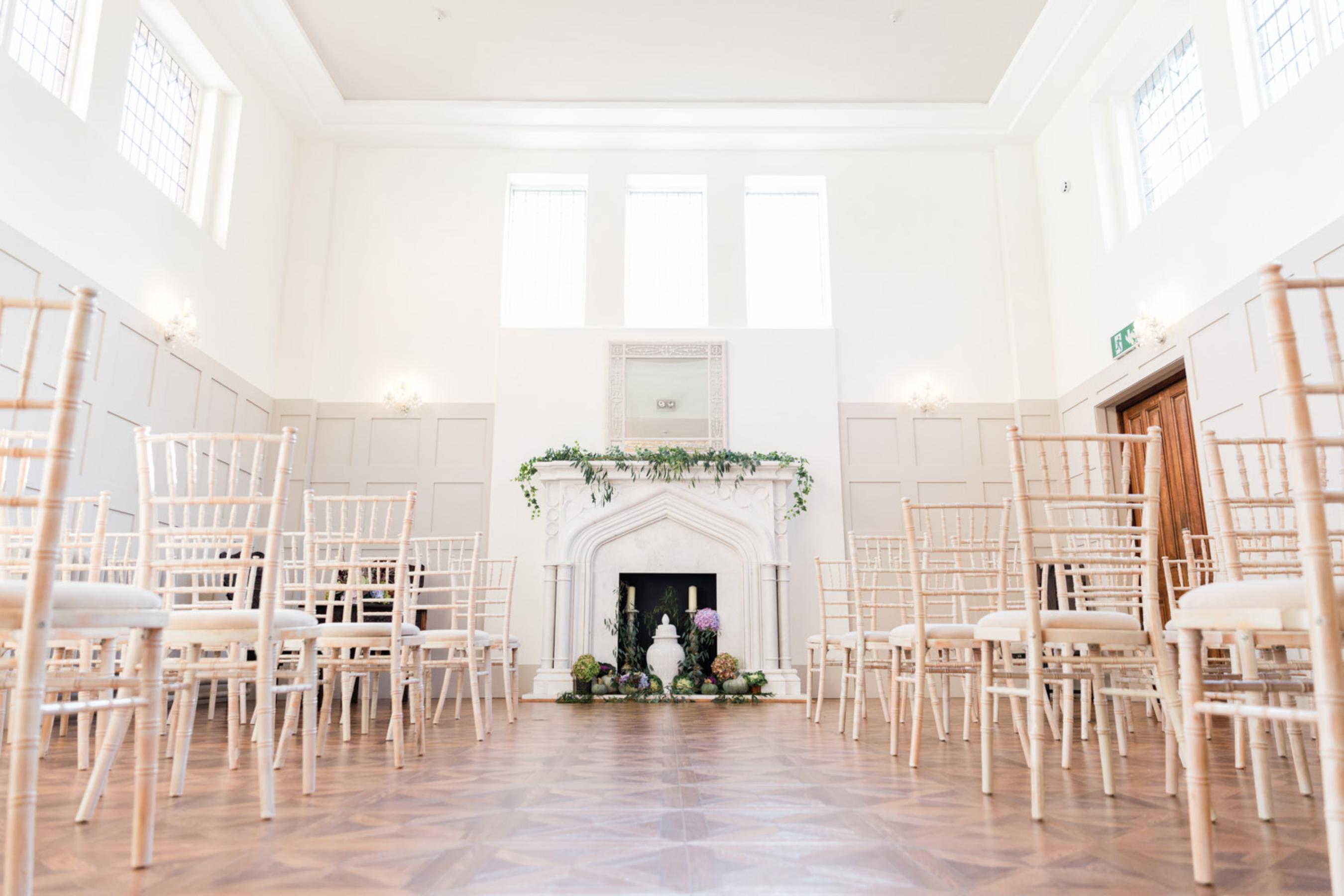 Elegant ceremony room at Thicket Priory showcasing historic features and high-standard interior d&eacute;cor
