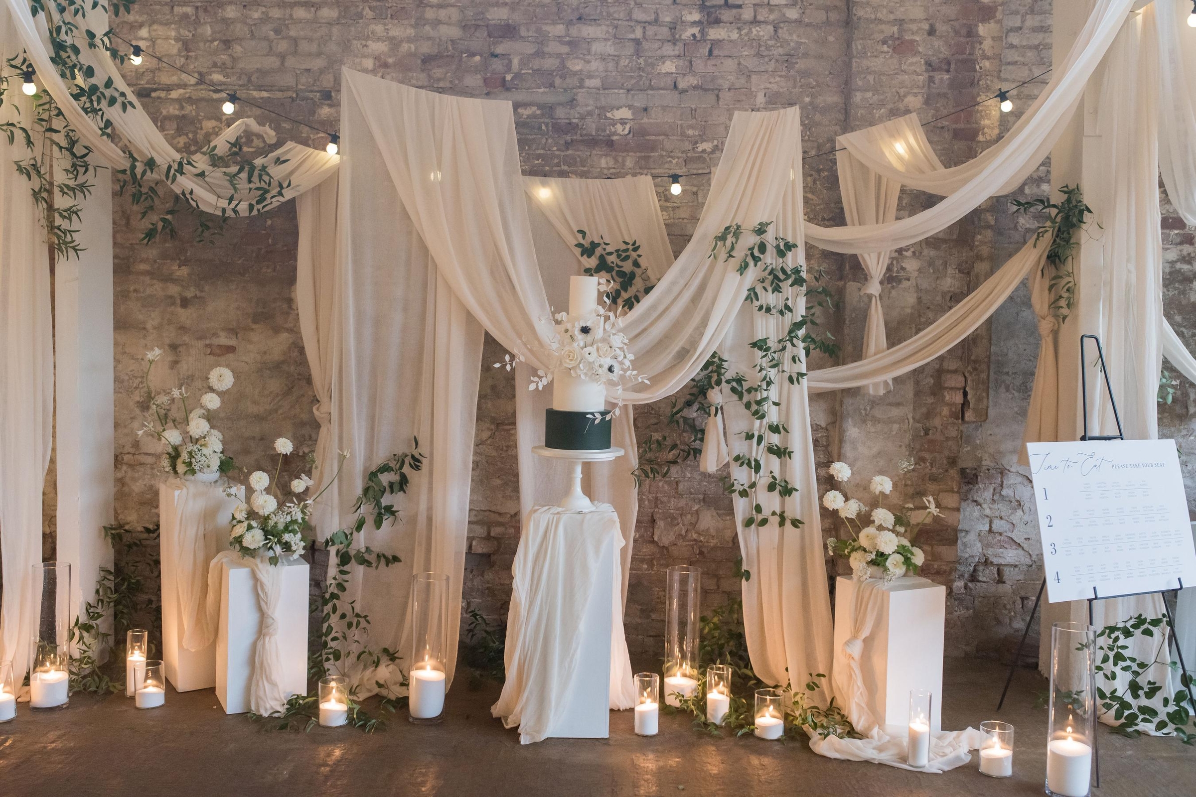 elegant-wedding-cake-display-draping-backdrop