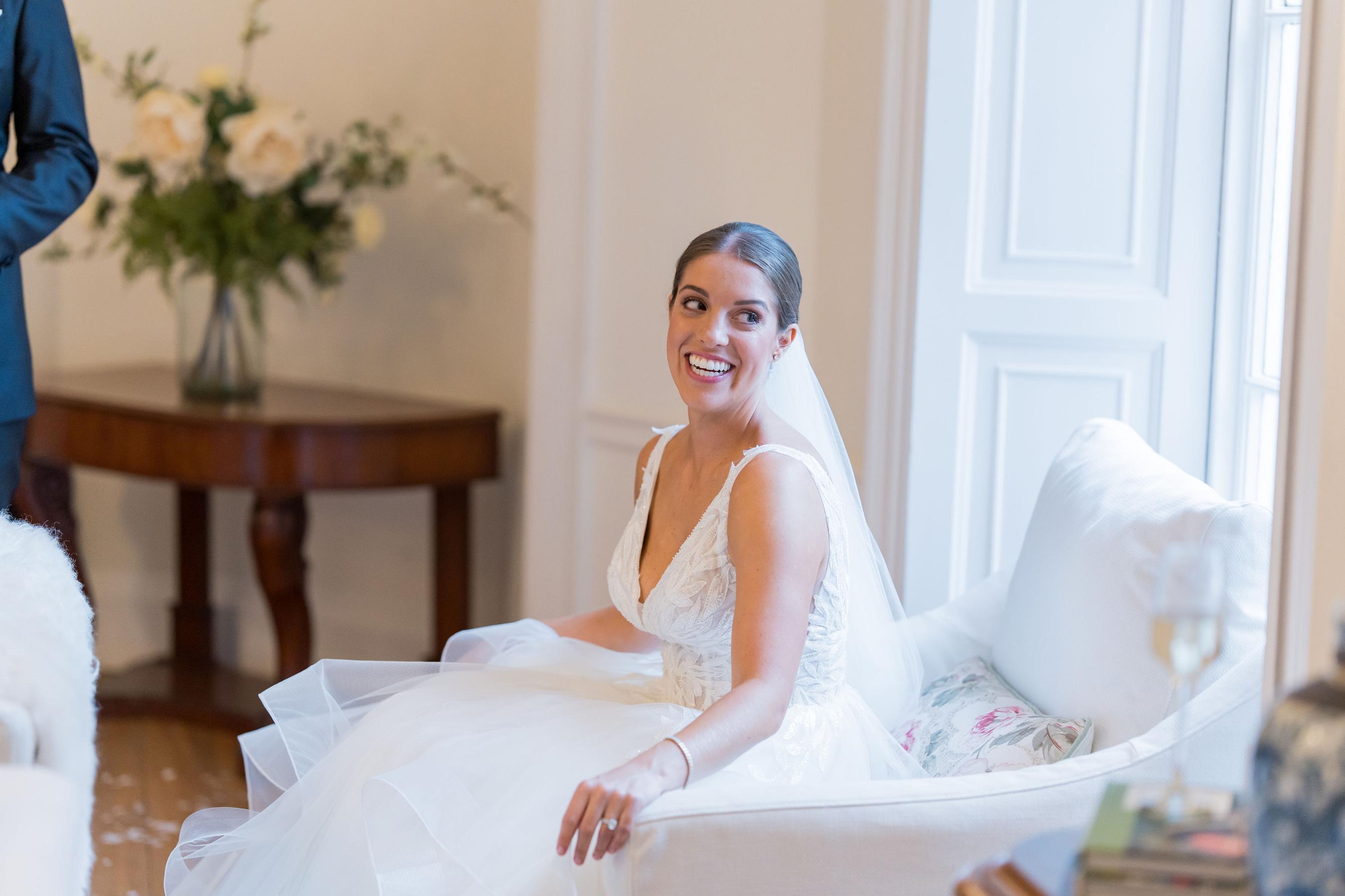 bride relaxed in the drwing room of an elegant country manor wedding venue